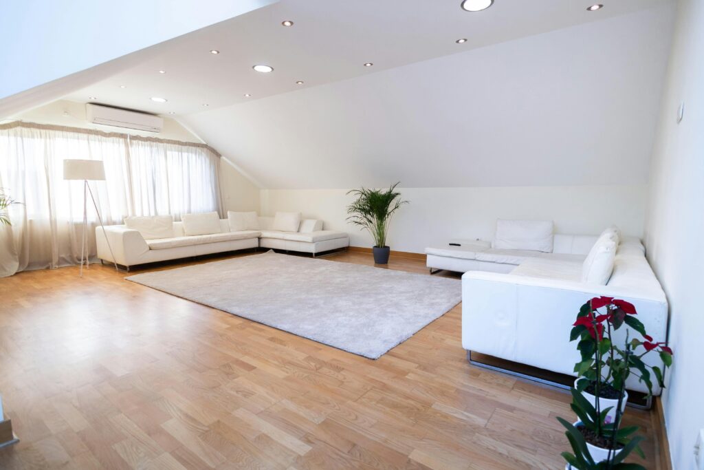 a converted attic renovated minimally with can lights
